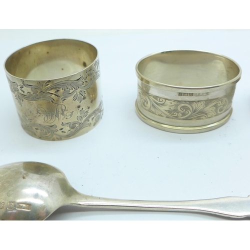 855 - Seven silver spoons, a pair of silver sugar bows and two silver napkin rings, 180g