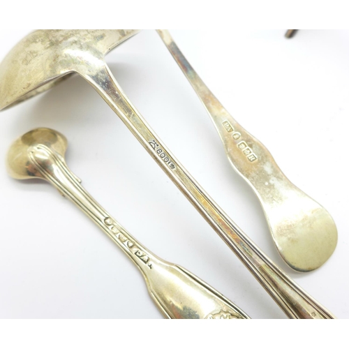 859 - A pair of silver knife rests, two silver ladles and one other silver spoon, 245g