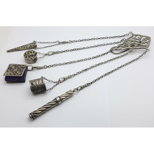 879 - A late Victorian silver chatelaine, clip and pencil with London marks, the four other attachments ha... 