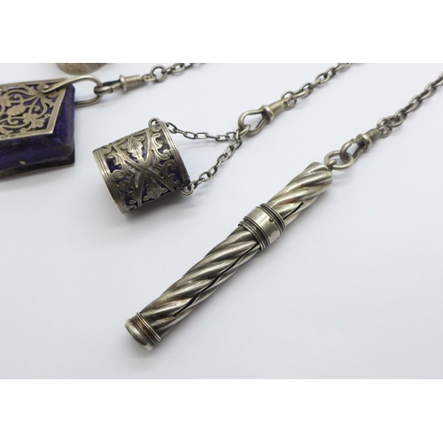 879 - A late Victorian silver chatelaine, clip and pencil with London marks, the four other attachments ha... 