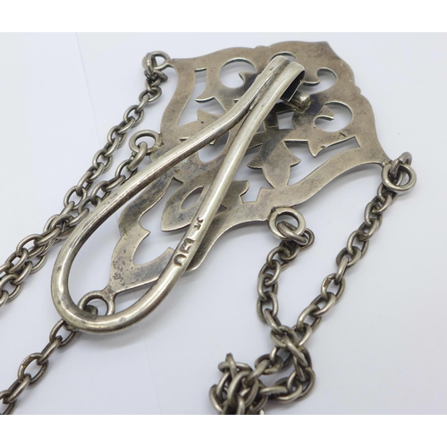 879 - A late Victorian silver chatelaine, clip and pencil with London marks, the four other attachments ha... 