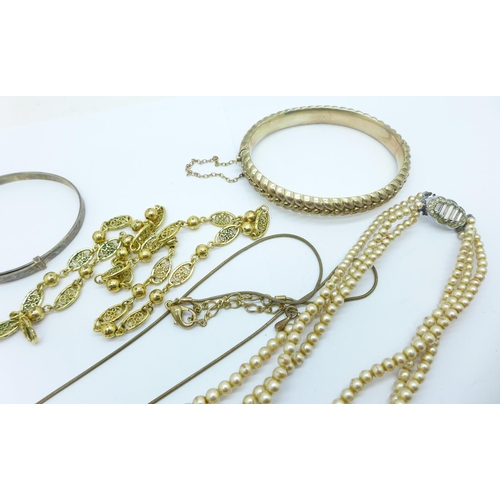 884 - Three bangles and other jewellery