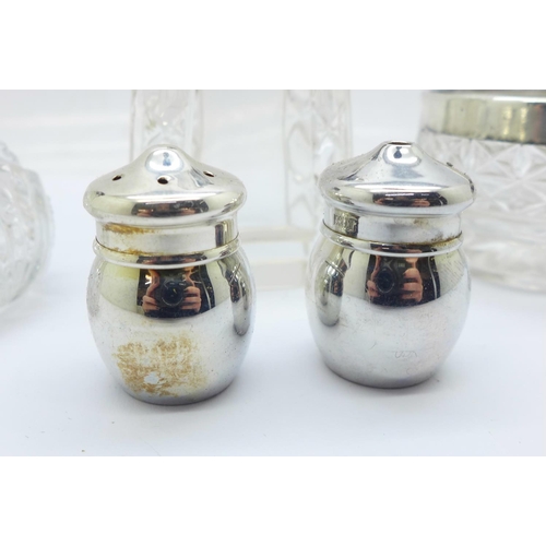 887 - A pair of silver salt and pepper pots and a silver mounted scent bottle, pepper pot and salt pot