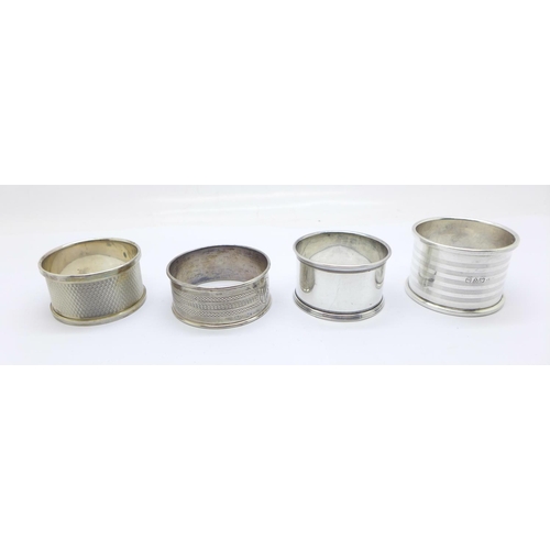 888 - Four silver hallmarked napkin rings, with dates from 1919 to 1955