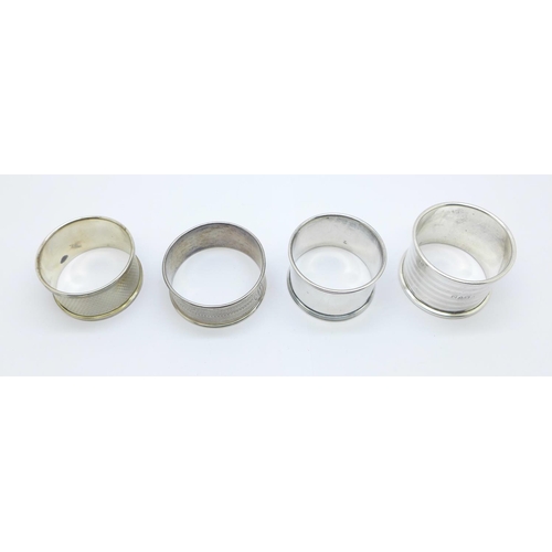 888 - Four silver hallmarked napkin rings, with dates from 1919 to 1955