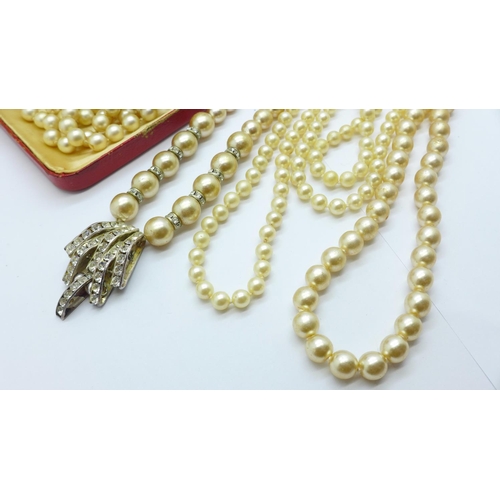 903 - A faux pearl necklace with 9ct gold clasp and other faux pearl necklaces