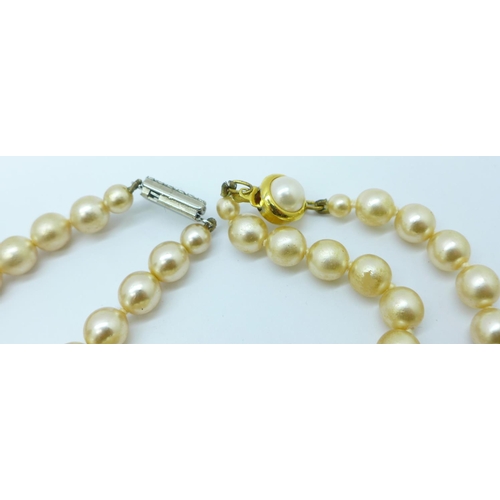 903 - A faux pearl necklace with 9ct gold clasp and other faux pearl necklaces