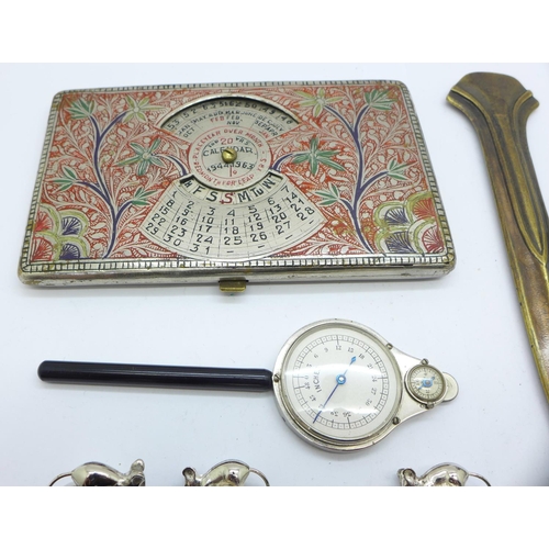 922 - A perpetual calendar, a cigarette case, a map measurer, a money clip, cheese menu holders, etc.