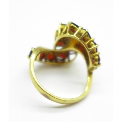 937 - An 18ct gold and garnet cluster ring, 6.2g, L