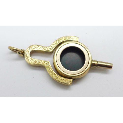 956 - Watch key/fob with onyx stone (tests as 9ct gold), 4.9g