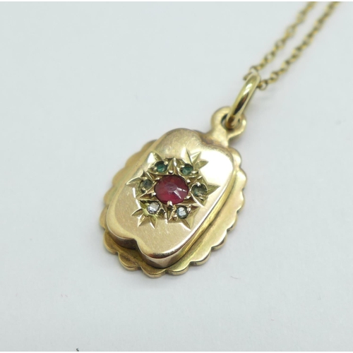 981 - A 9ct gold, ruby and diamond pendant, 1.5g, on a 925 silver gilt chain