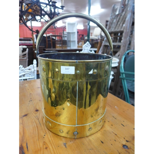 366 - An Arts and Crafts brass coal bucket