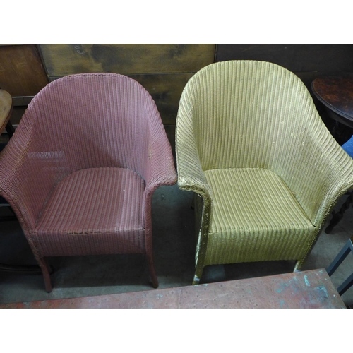 325a - Two painted wicker armchairs