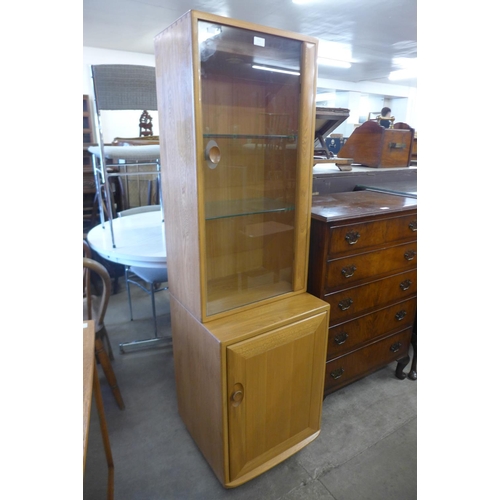 114 - An Ercol Blonde side cabinet