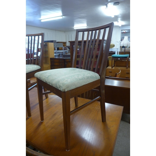 119 - A Vanson teak extending dining table and six chairs