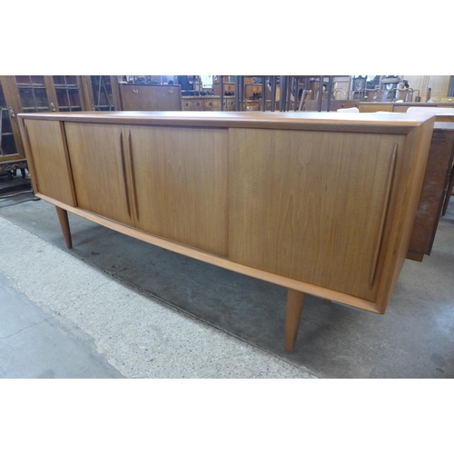 134 - A Danish H.P. Hansen teak bow front sideboard