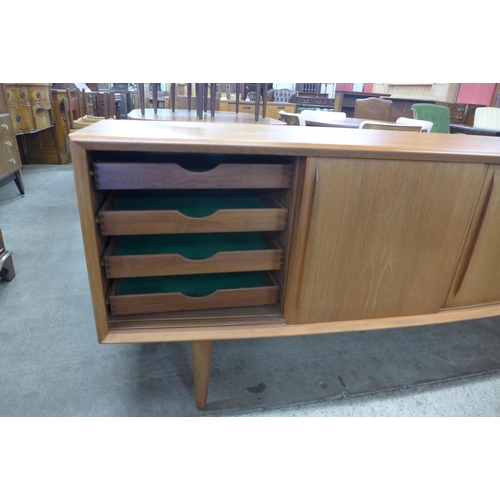 134 - A Danish H.P. Hansen teak bow front sideboard