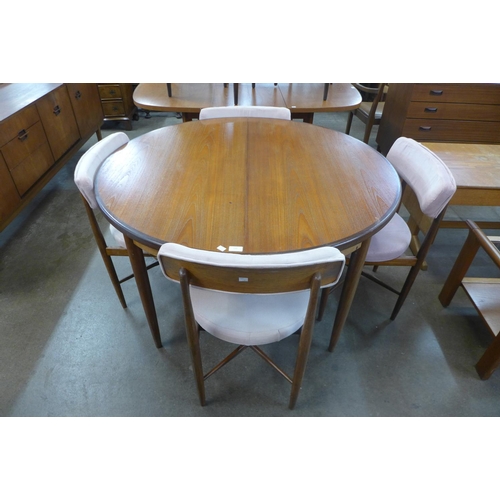 136 - A G-Plan Fresco teak extending dining table and four chairs