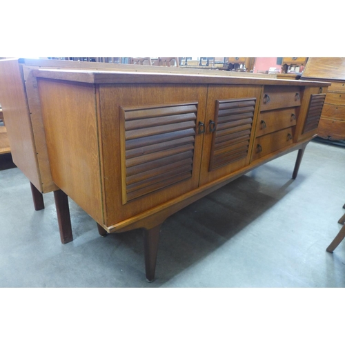 142 - A teak sideboard