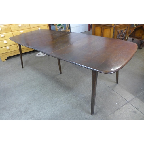 143 - An Ercol dark Grand dining table