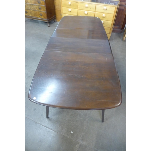 143 - An Ercol dark Grand dining table