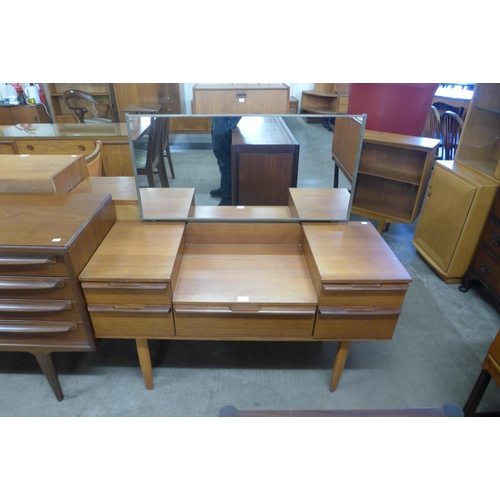 151a - An Avalon teak dressing table