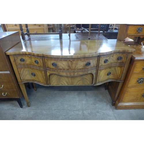 158 - A George III style inlaid mahogany serpentine sideboard