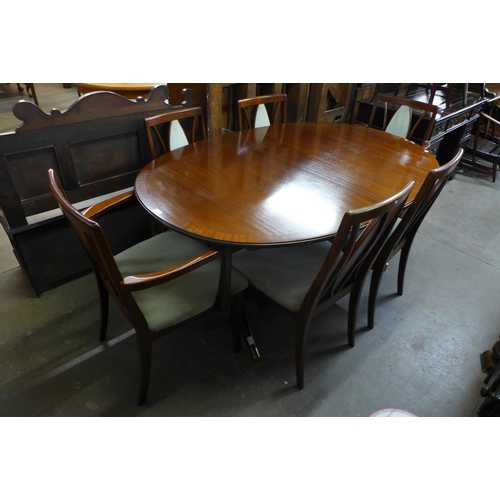 163 - A G-Plan mahogany extending dining table and six chairs