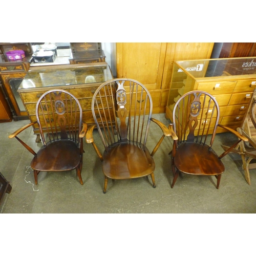 166 - Three Ercol dark low armchairs