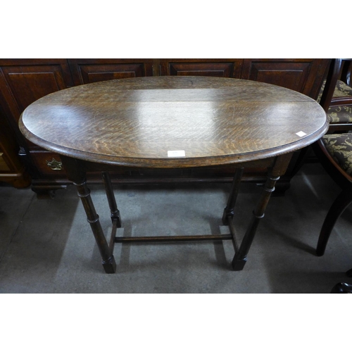 175 - An oak oval occasional table