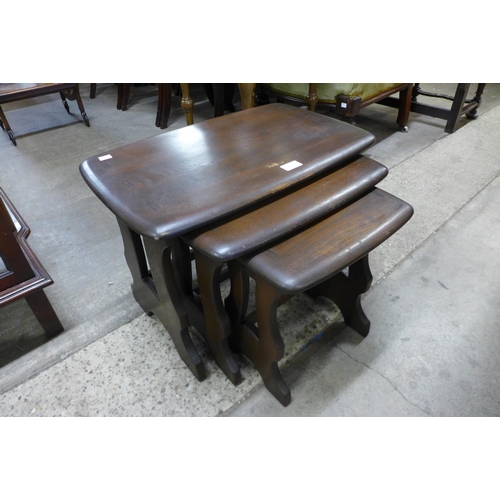 185 - An Ercol dark nest of tables