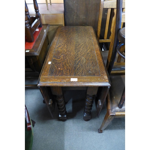 186 - An oak barleytwist drop leaf table