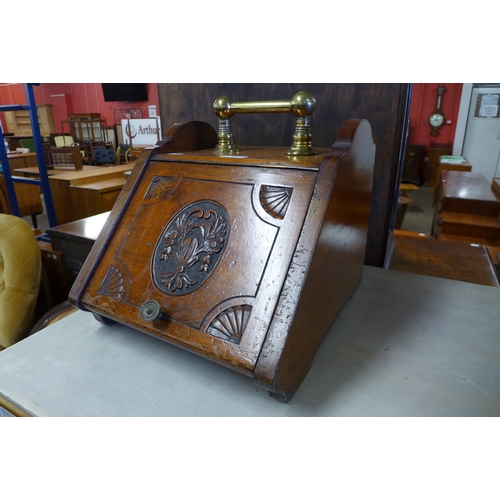 195 - A Victorian carved beech coal scuttle