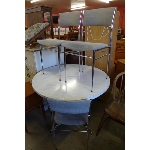 199 - A chrome and Formica topped extending kitchen table and three chairs