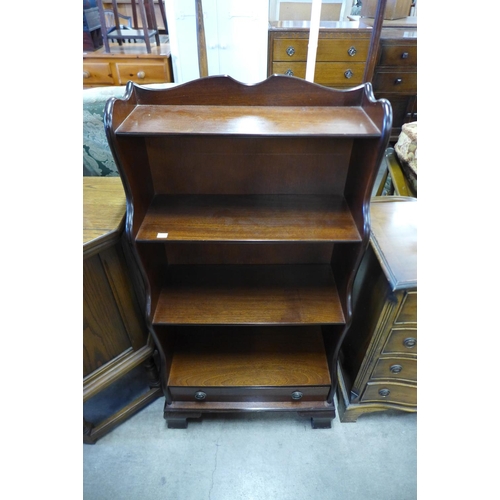 207 - A mahogany open waterfall front bookcase