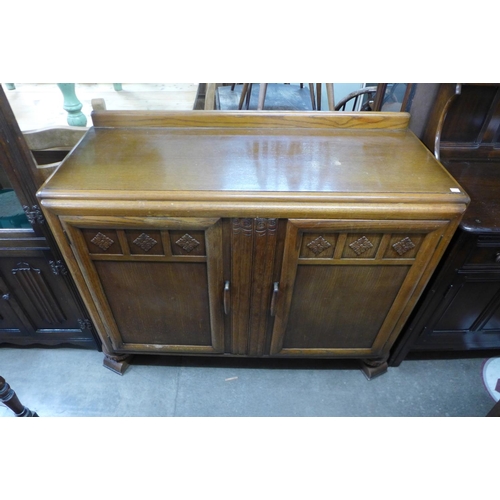 226a - An Art Deco oak fitted sideboard by, C.W.S. Ltd., Radcliffe