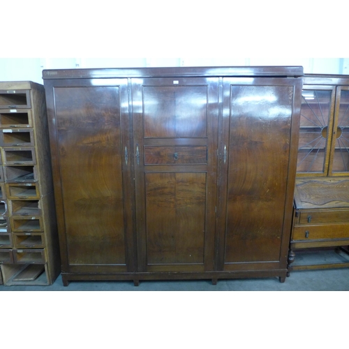 227 - An early 20th Century mahogany three door Compactum wardrobe