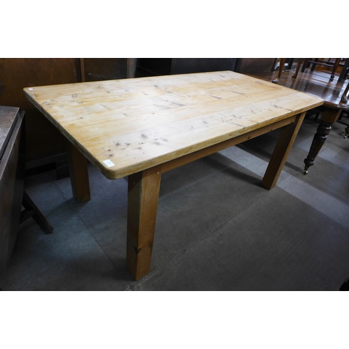 232 - A pine kitchen table