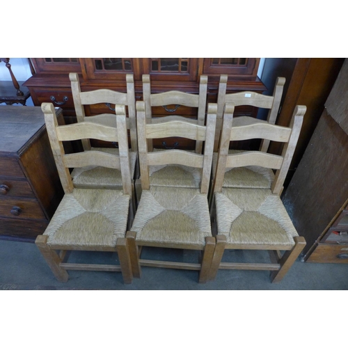 233 - A set of six pine and rush seated kitchen chairs