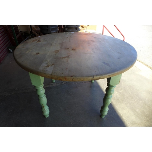 234 - A pine scrub top circular kitchen table