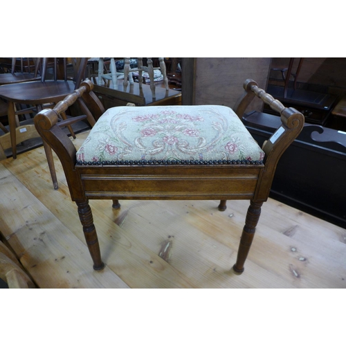 236 - A Victorian walnut piano stool