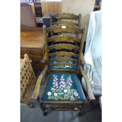 241 - A pair of elm ladderback elbow chairs