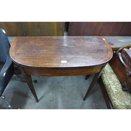 247 - A George III inlaid mahogany demi lune card table