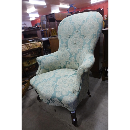 255 - A Victorian mahogany and upholstered armchair