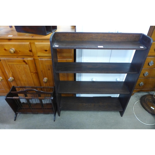 257 - A mahogany magazine rack and an oak open bookcase