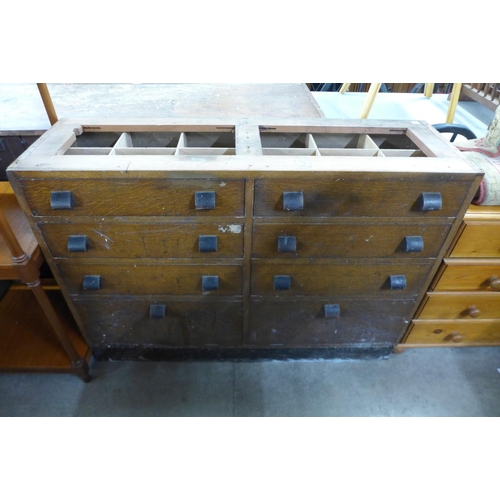 284 - An oak pharmacist's cabinet (lacking top and sides)