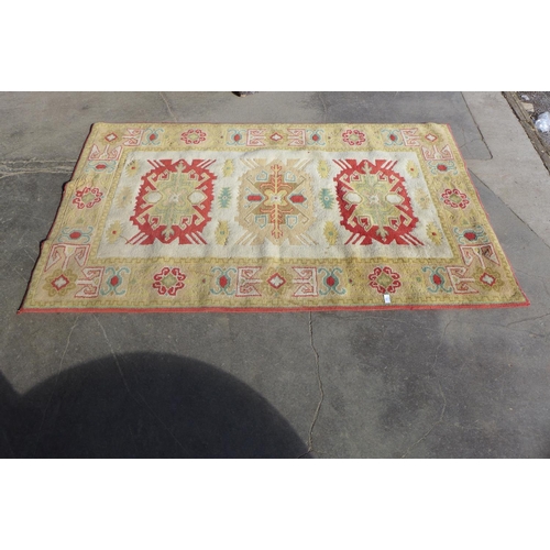 286 - A Turkish cream ground rug