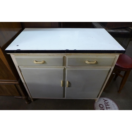 291 - A 1960's painted metamorphic kitchen cabinet