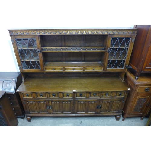 296 - A carved oak dresser