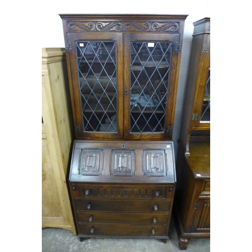 297 - An oak bureau bookcase